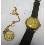 A Garrard watch and pendant marked 18k on chain