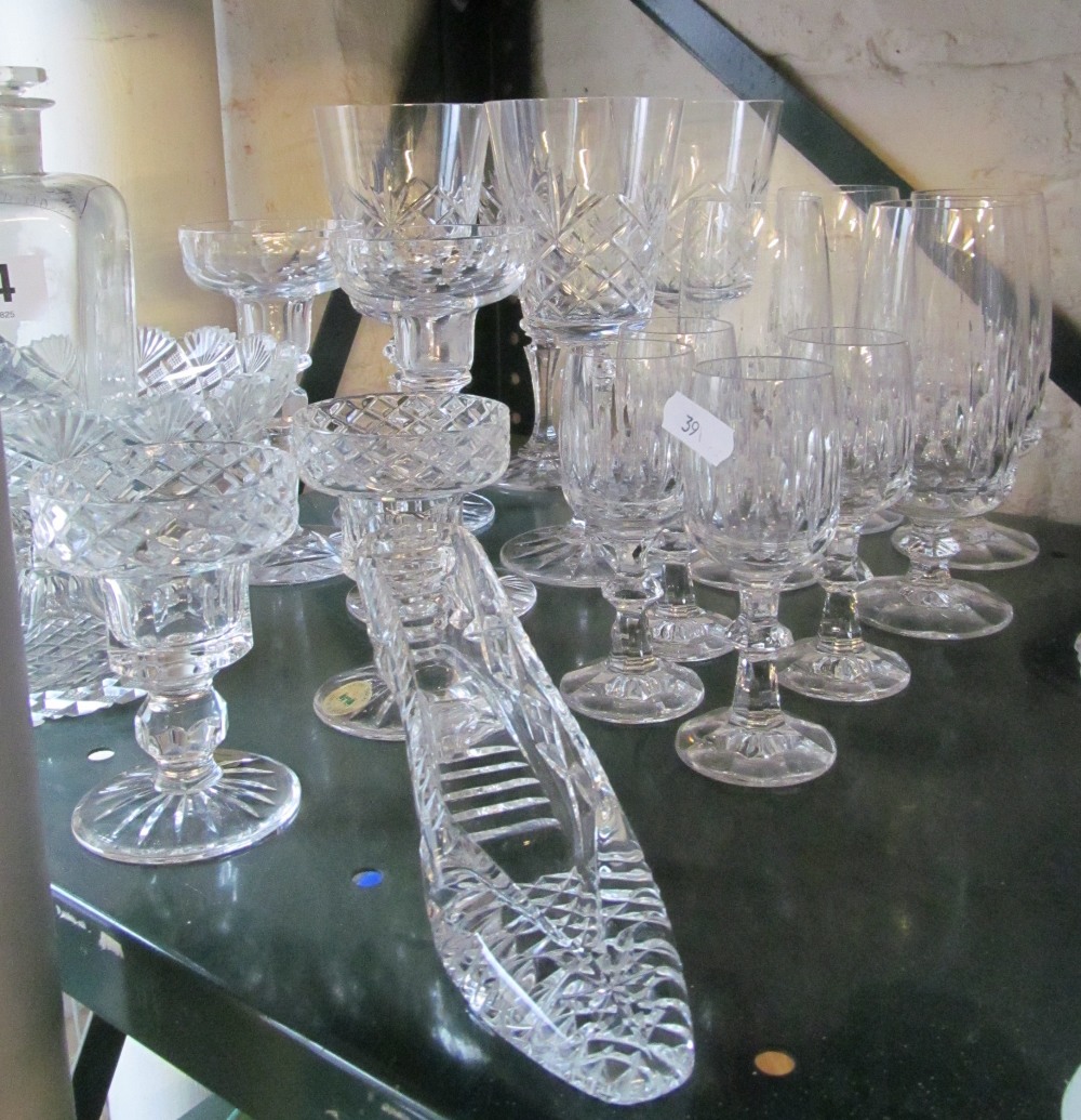 Four small glasses, four small flutes and other glass