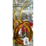 An amber glass abstract sculpture