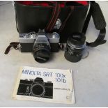 A Minolta camera and lens (i.c)