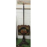 A Victorian pole screen with embroidered inset on triform base