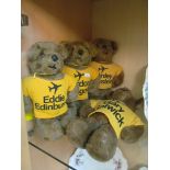 Four bears with airport t-shirts