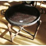 A 1920s tray top table on bobbin turned folding stand