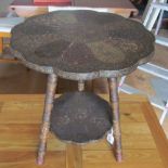 A shaped edge two tier table painted with birds and flowers