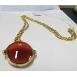 A yellow metal chain marked 750 and a 9ct gold fob set agate style stone