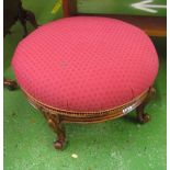 A Victorian large circular stool on cabriole legs