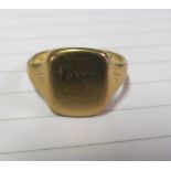 A 9ct gold signet ring 5.8g size R and a 9ct gold band 1.2g