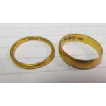 A 22ct gold band (misshapen) 3.7g and a 22ct gold band size N/O 2.6g