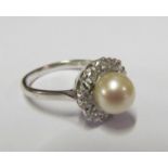 An 18ct pearl and diamond ring size O 4.6g