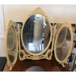 A cream triple dressing table mirror