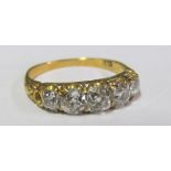 A diamond ring five graduated stones on 18ct gold band, ring size O
