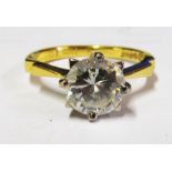 An 18ct gold single stone diamond ring with two obvious inclusions, approximately 1.5 carat spread