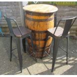 A barrel as table for wine bar and four chairs