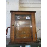 An Edwardian oak smoker's cabinet