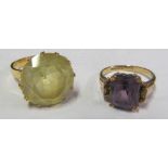 A 9ct amethyst coloured stone ring and yellow metal ring marked 18k and an 18ct ring