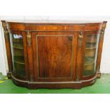 A Victorian walnut and inlaid credenza with ormulu mounts caryatid figures