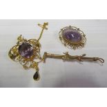 A 9ct and purple stone brooch, Edwardian gold coloured pendant and 9ct gold fox brooch