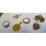 A gold coloured brooch, back and front pendant, medal, two rings, pendant brooch and a locket
