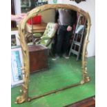 A large 19th Century gilt overmantel mirror with tree trunk and flower design frame