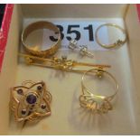 A 9ct brooch, three rings, butterfly brooch and an earring 9.3gm