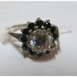 A blue and white stone cluster ring on silver band, blue and white stone ring on 18ct gold band