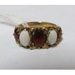 A 9ct opal and red five stone ring 3.3gm, size K