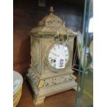 A brass mantel clock (dial a/f)