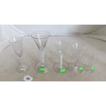 Three airtwist drinking glasses and two other antique glasses
