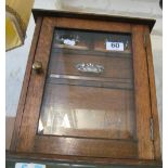 An Edwardian oak smoker's cabinet