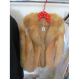 A short fox fur coat