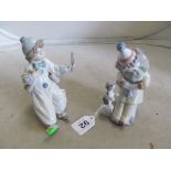 A Lladro clown with mirror and another clown with dog