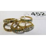 Three 9ct gold rings, 15ct CZ ring and another CZ ring