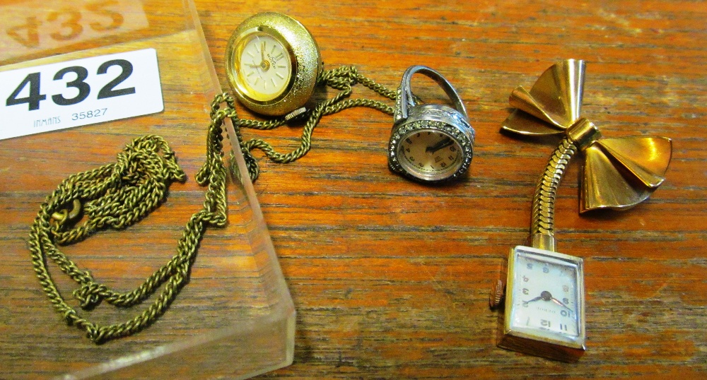 A Burcherer watch ring marked C.B 925, a Debor watch on bow brooch and a Buler pendant watch and