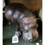 A leather hippo with glass eyes