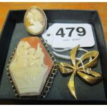 A 9ct gold bow brooch and two cameo brooches