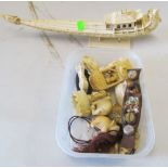 A box ivory items including elephant and a boat