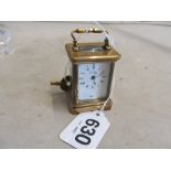 A miniature brass cased carriage clock