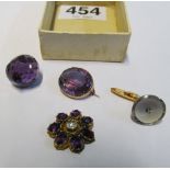 A gold coloured amethyst brooch, a gold coloured brooch (a/f), an 18ct gold cufflink and inset