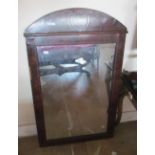 A large swing mirror and an arch top mirror