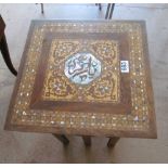An eastern occasional table geometric design of various woods and inlaid mother of pearl