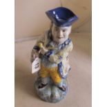 A character jug man holding pipe and jug (hat repaired)