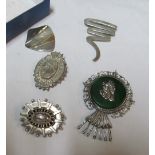 A Sterling brooch with stripes, marked 104 and four brooches