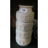 A West German white pottery vase with bands of floral design