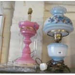 An oil style lamp with blue floral shade and body (electric) and a pink glass lustre converted to