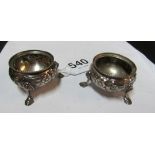 A pair of Victorian silver salts embossed floral decoration