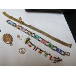 A 9ct bracelet, enamel strap bracelet, stamp bracelet, locket and a pair of earrings