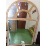 A wicker frame mirror