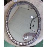 A similar smaller oval mirror with clear glass surround