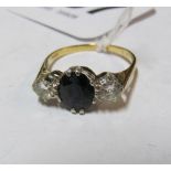 An 18ct gold three stone sapphire and diamond ring, size P 3.3gm