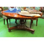 A 19th Century circular mahogany dining table on turned column and triform base